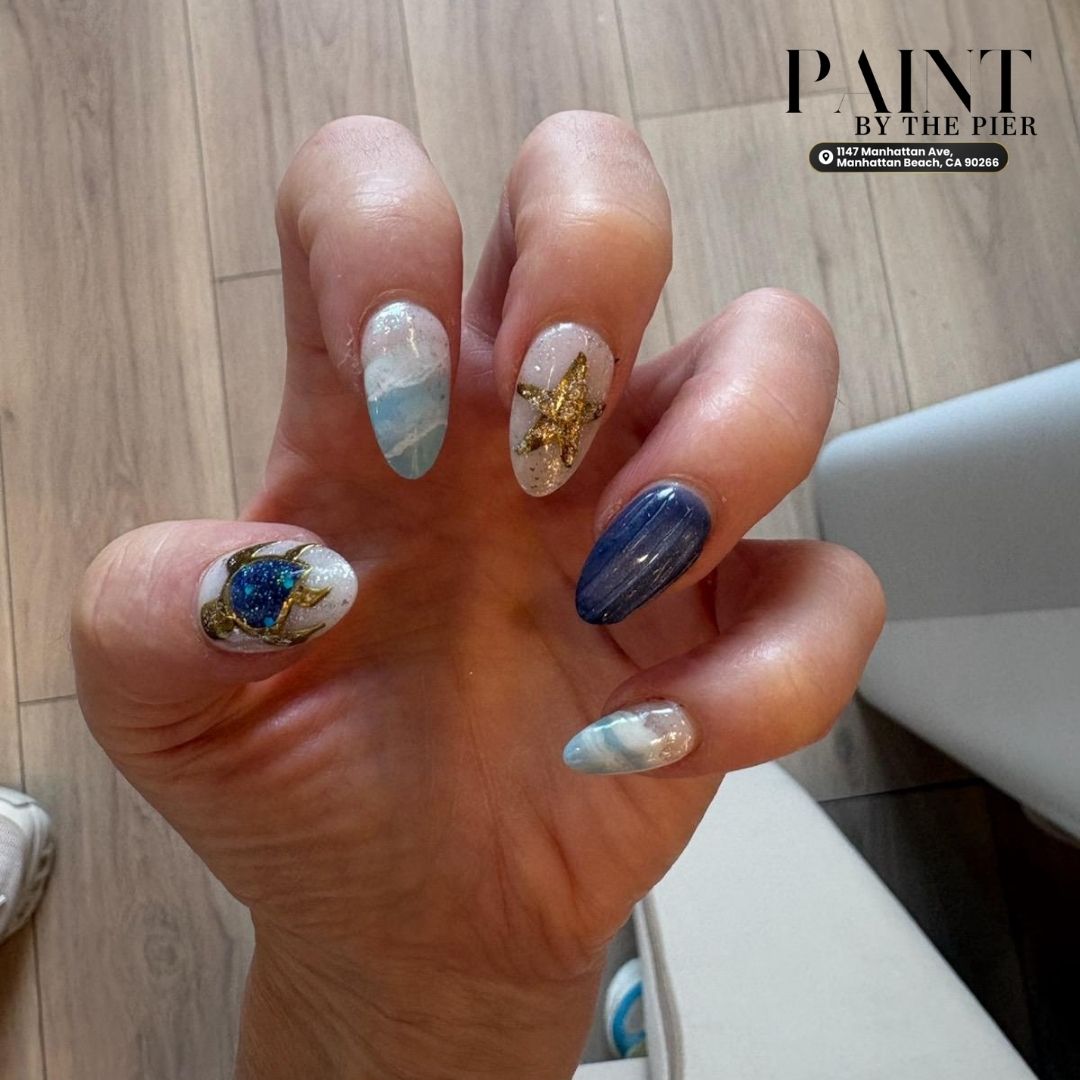 Beach-themed ocean blue manicure with 3D starfish and seashell accents steps from Manhattan Beach Pier